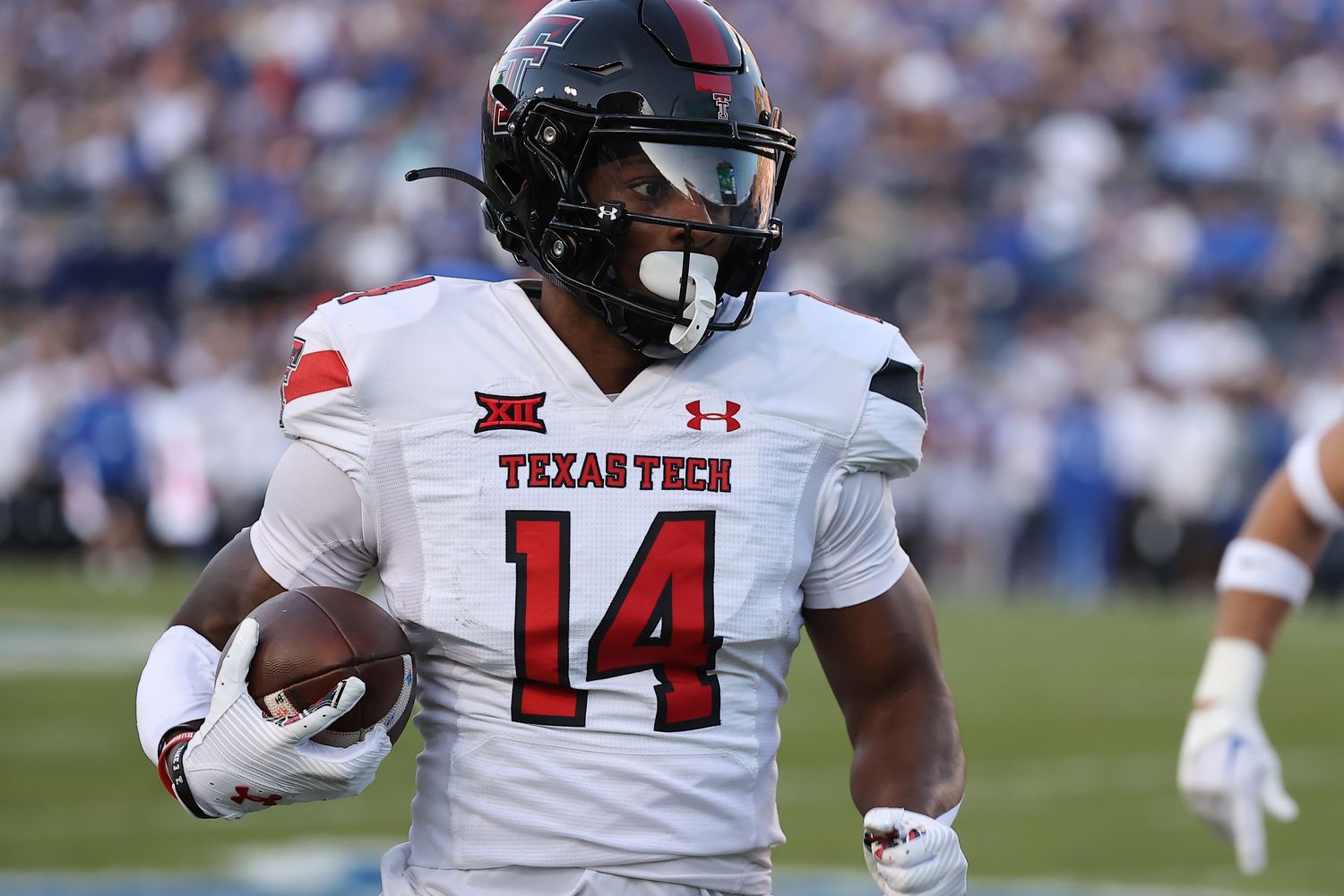 Oct 21, 2023; Provo, Utah, USA; Texas Tech Red Raiders wide receiver Xavier White (14) makes a catch and runs for a touchdown against the Brigham Young Cougars in the second quarter at LaVell Edwards Stadium. Mandatory Credit: Rob Gray-USA TODAY Sports  